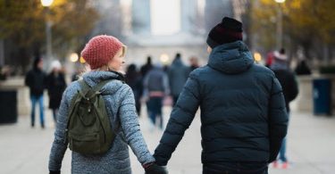 Couple holding hands